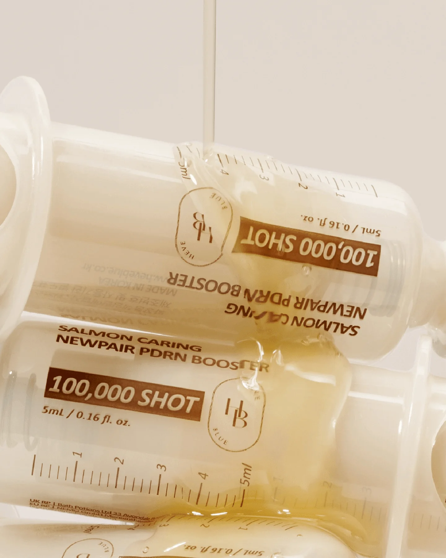 HEVEBLUE Salmon Caring Centella Newpair PDRN Booster 100,000 Shot Essence 5ml - Image 2